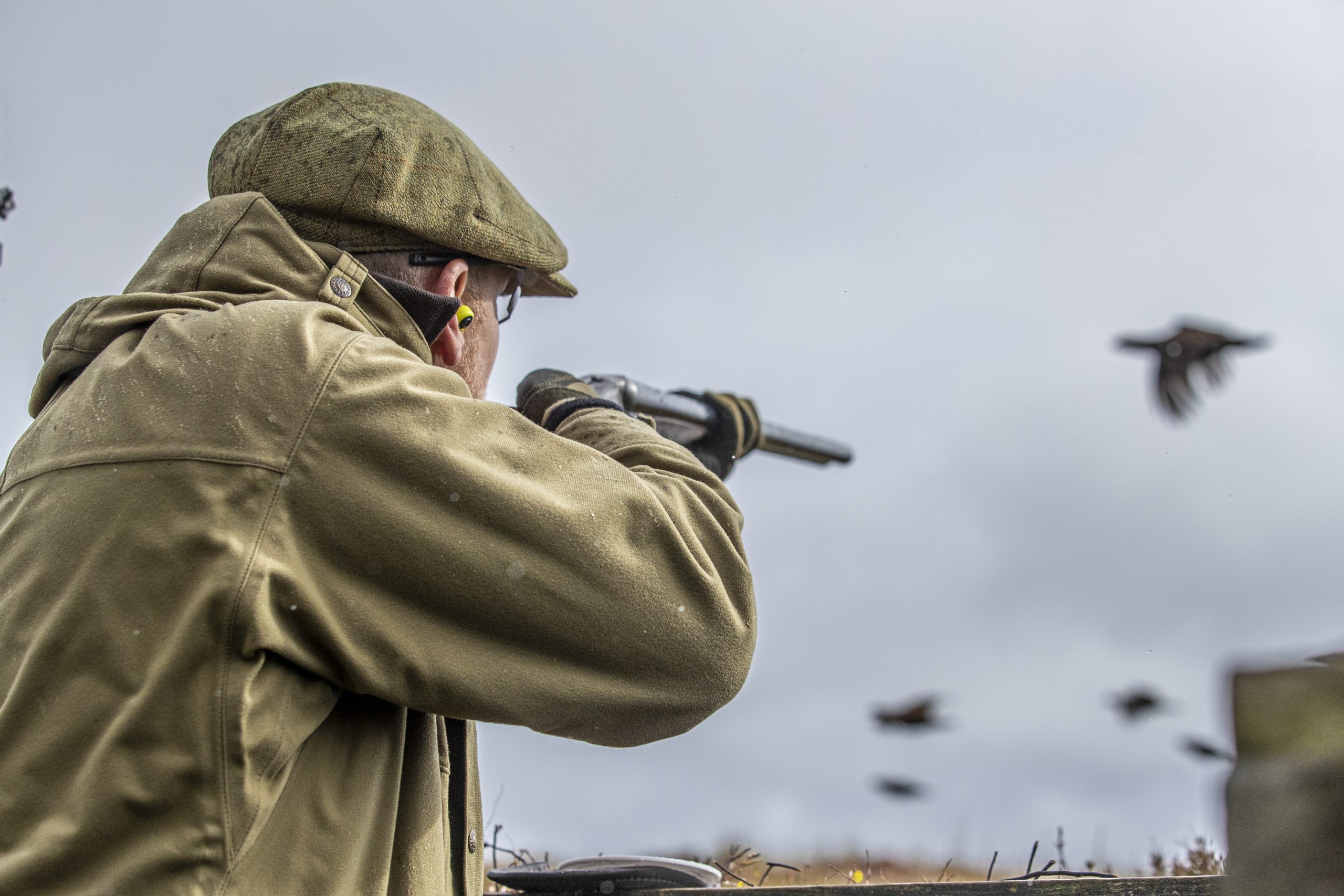 Man shooting at driven birds