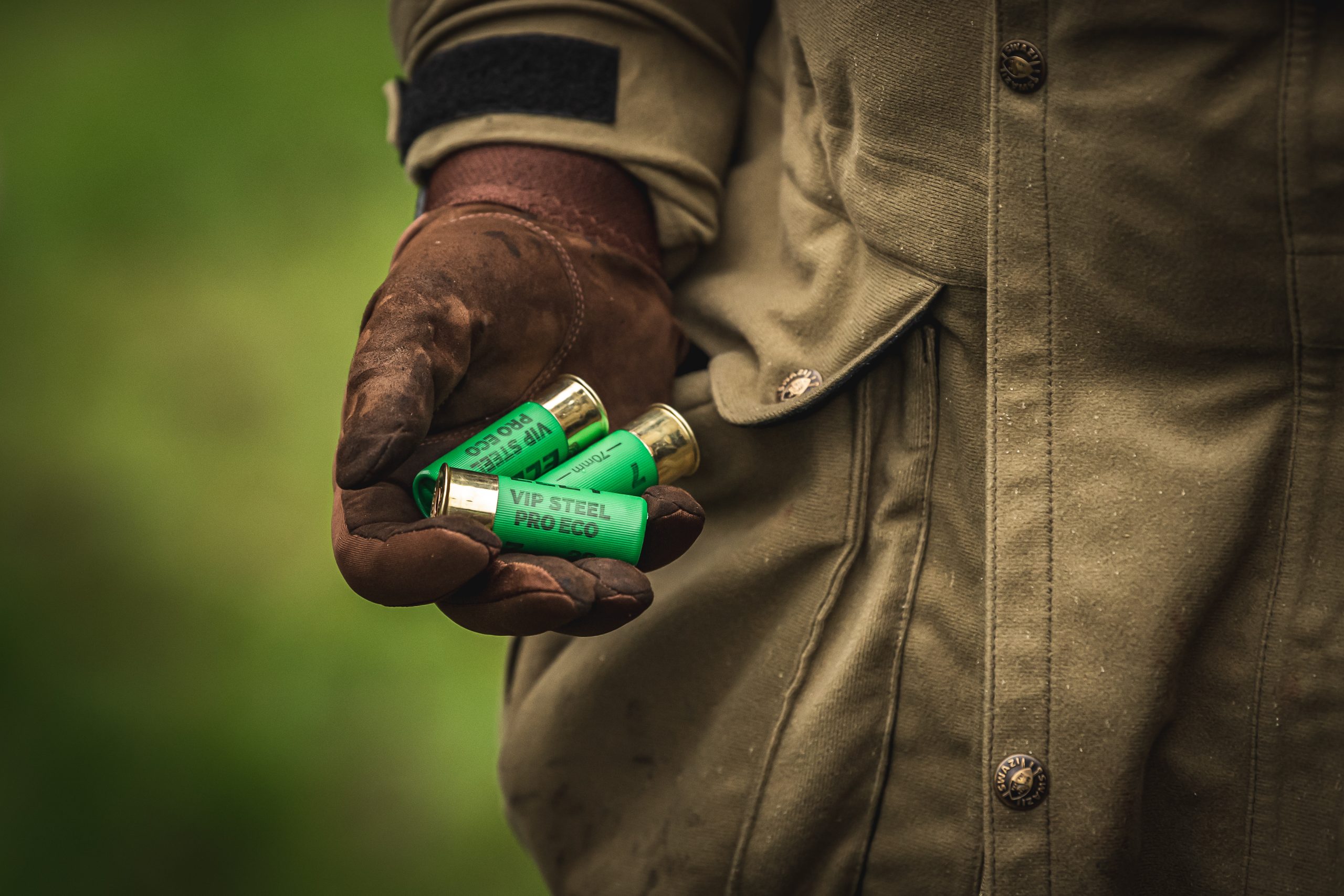 Man holding game cartridges in his hand