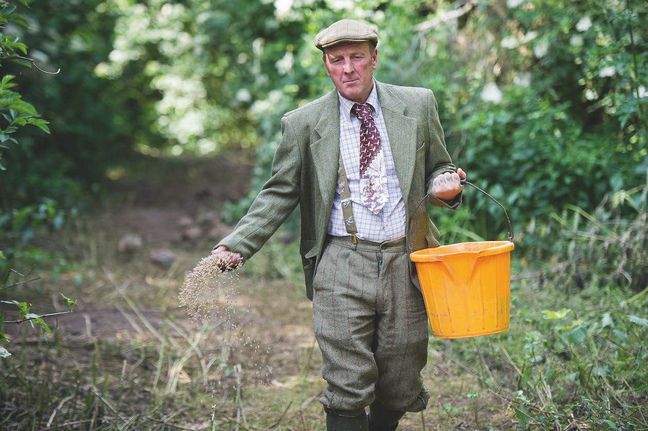 Gamekeeper hand feeding